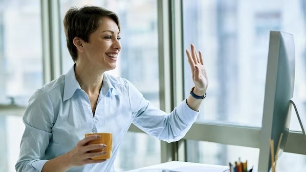 Woman communicates via video call via computer